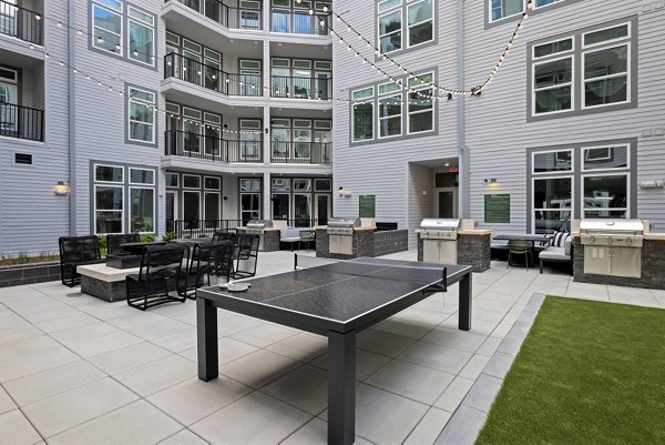 grill area/fire pit/patio at Mira Apartments