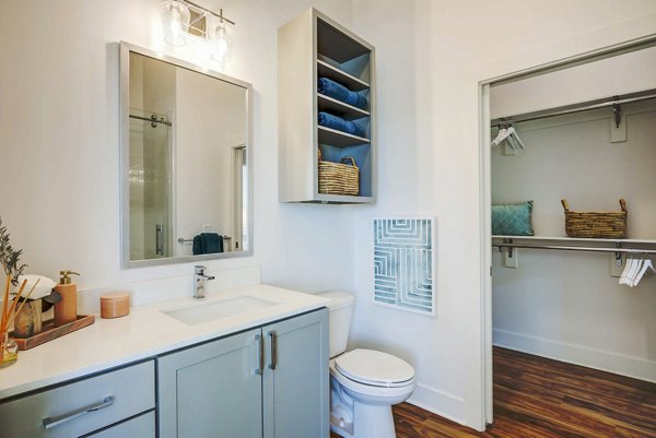 Modern bathroom featuring sleek fixtures and spacious design at Queens Wedgewood Houston Apartments