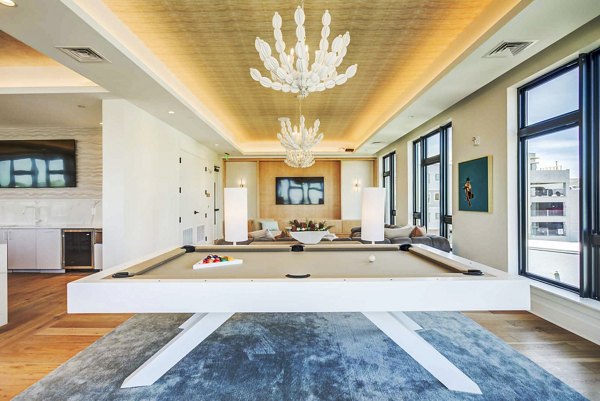 Clubhouse game room featuring pool table and modern decor at Queens Wedgewood Houston Apartments