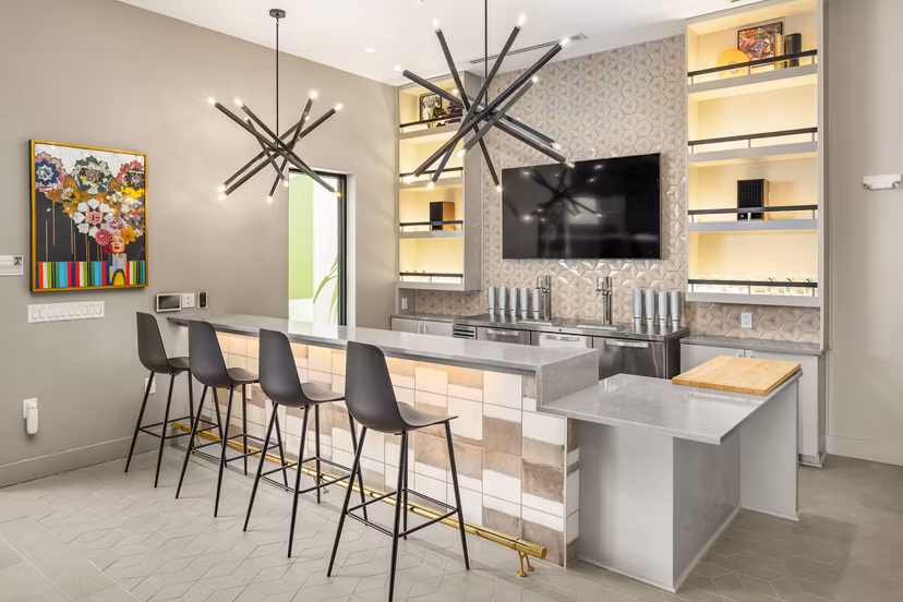 Clubhouse with modern design and cozy seating at Queens Wedgewood Houston Apartments