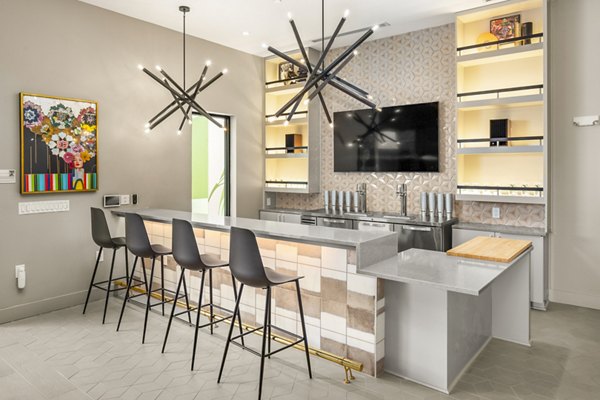 Clubhouse with modern design and cozy seating at Queens Wedgewood Houston Apartments