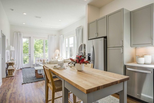 Dining room with chic lighting and modern decor at Queens Wedgewood Houston Apartments