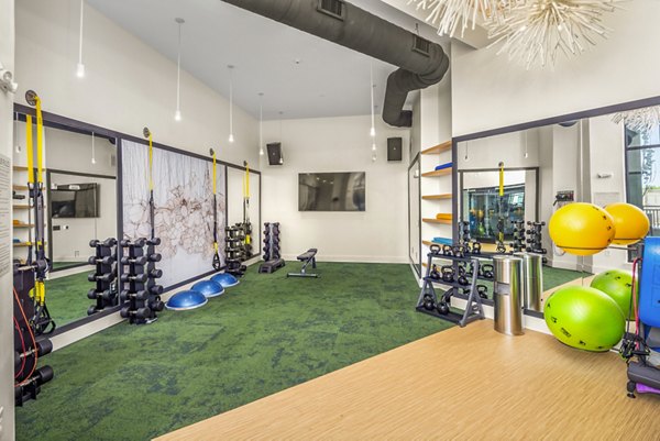 State-of-the-art fitness center with modern equipment at Queens Wedgewood Houston Apartments