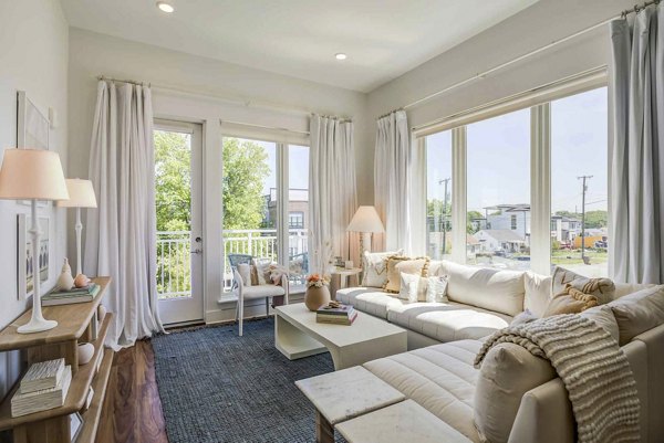 Modern living room with sleek furnishings at Queens Wedgewood Houston Apartments