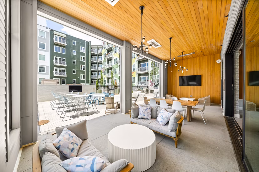 Open-air patio with city views at Queens Wedgewood Houston Apartments, offering luxury living with outdoor relaxation space