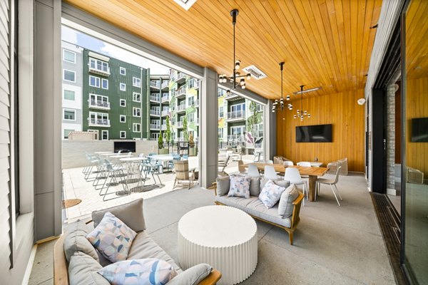 Open-air patio with city views at Queens Wedgewood Houston Apartments, offering luxury living with outdoor relaxation space