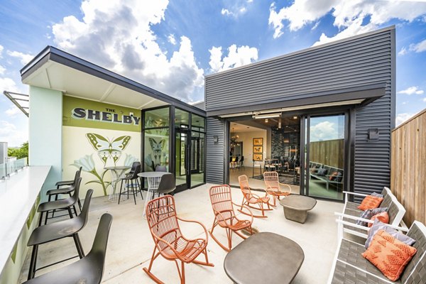 Patio with cozy seating at Queens Wedgewood Houston Apartments: Luxury outdoor space in Nashville Perfect for relaxation and entertainment