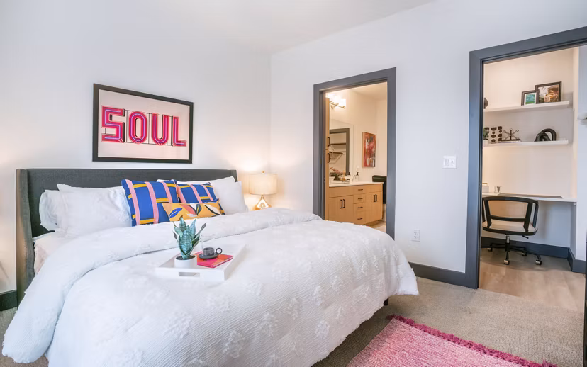 Bedroom with modern decor and elegant furnishings at The Sommery Apartments, a Greystar luxury property