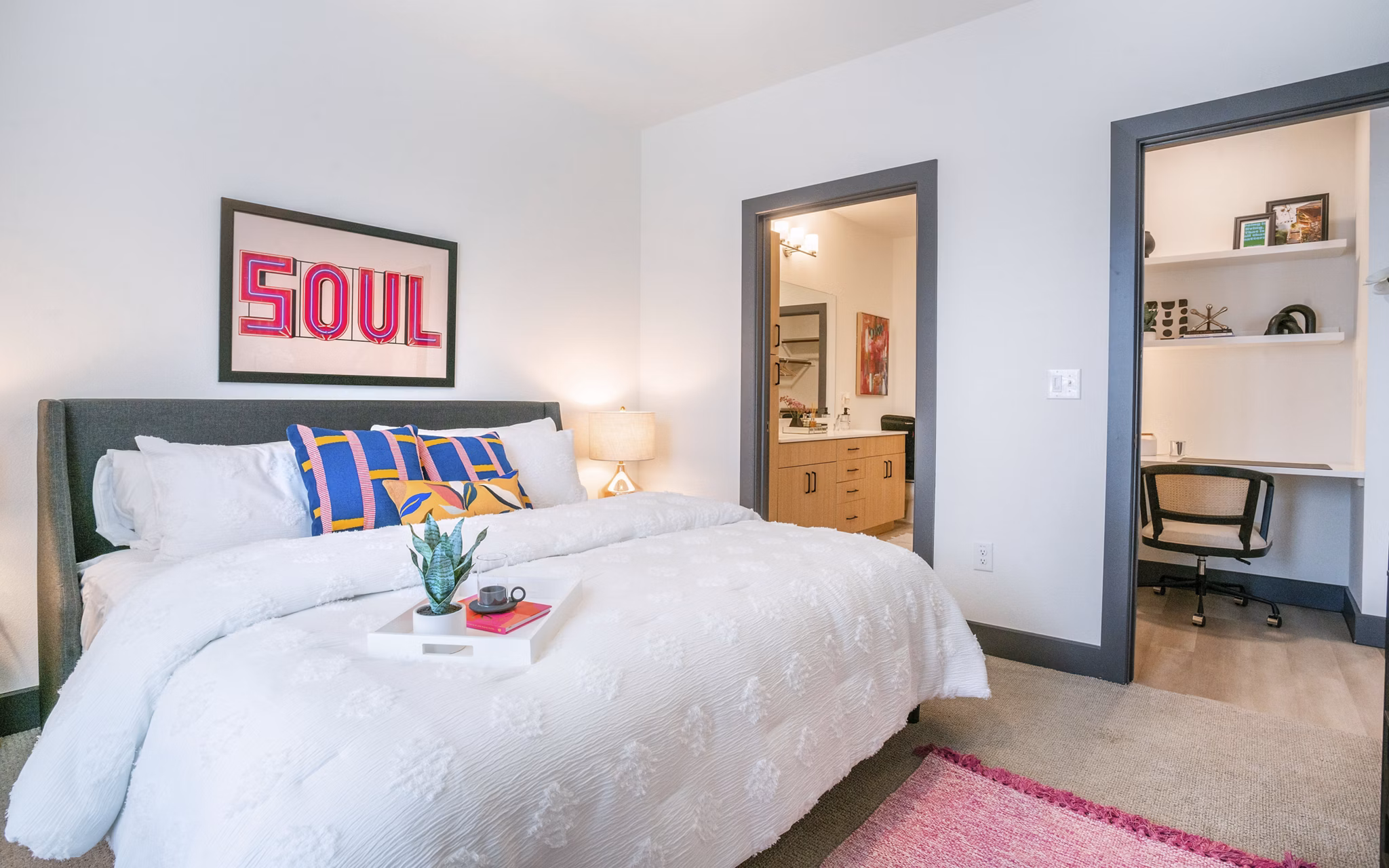 Bedroom with modern decor and elegant furnishings at The Sommery Apartments, a Greystar luxury property