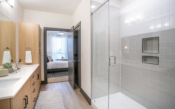 Luxurious bathroom with modern fixtures at The Sommery Apartments