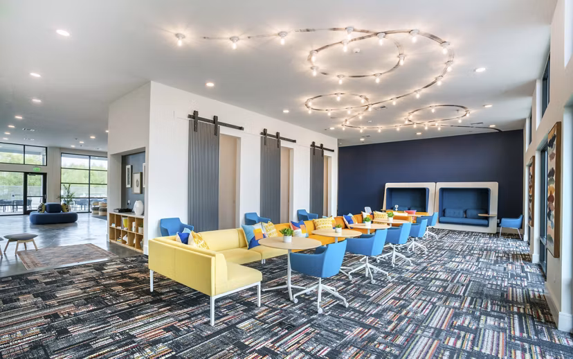 Clubhouse at The Sommery Apartments featuring stylish seating and modern decor for luxury living