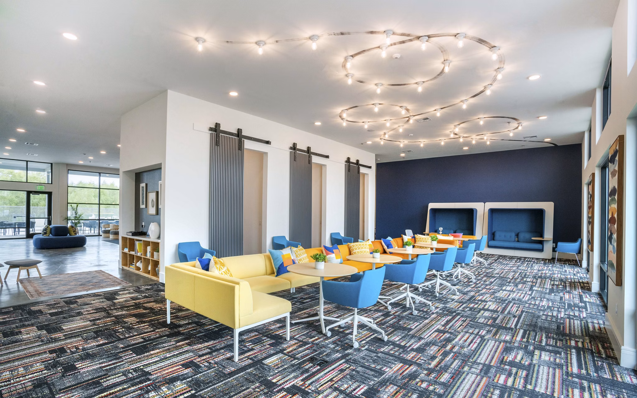 Clubhouse at The Sommery Apartments featuring stylish seating and modern decor for luxury living