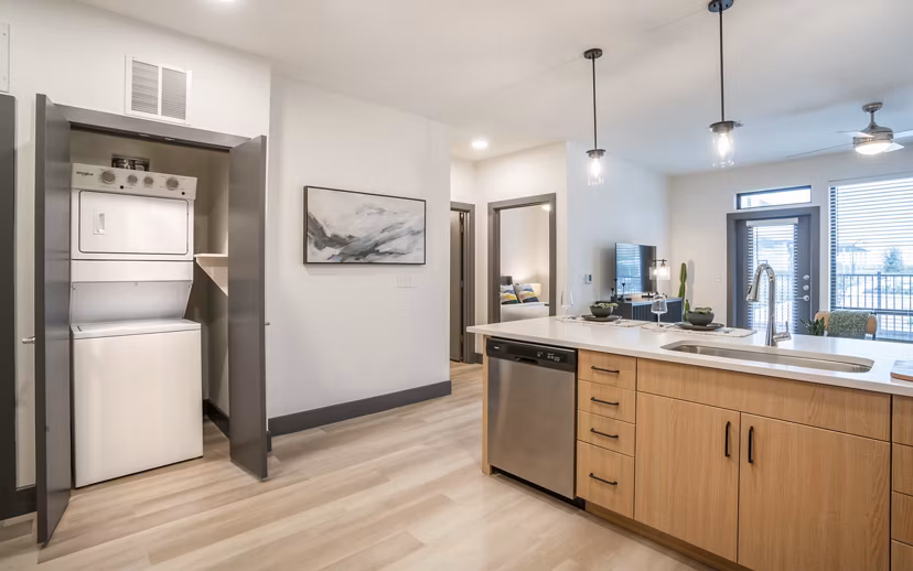 Laundry room with modern appliances at The Sommery Apartments