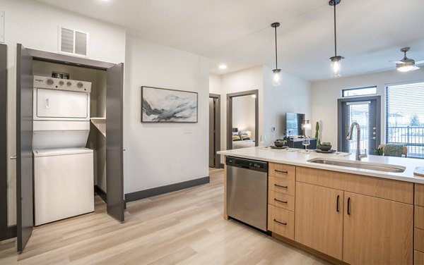 Laundry room with modern appliances at The Sommery Apartments