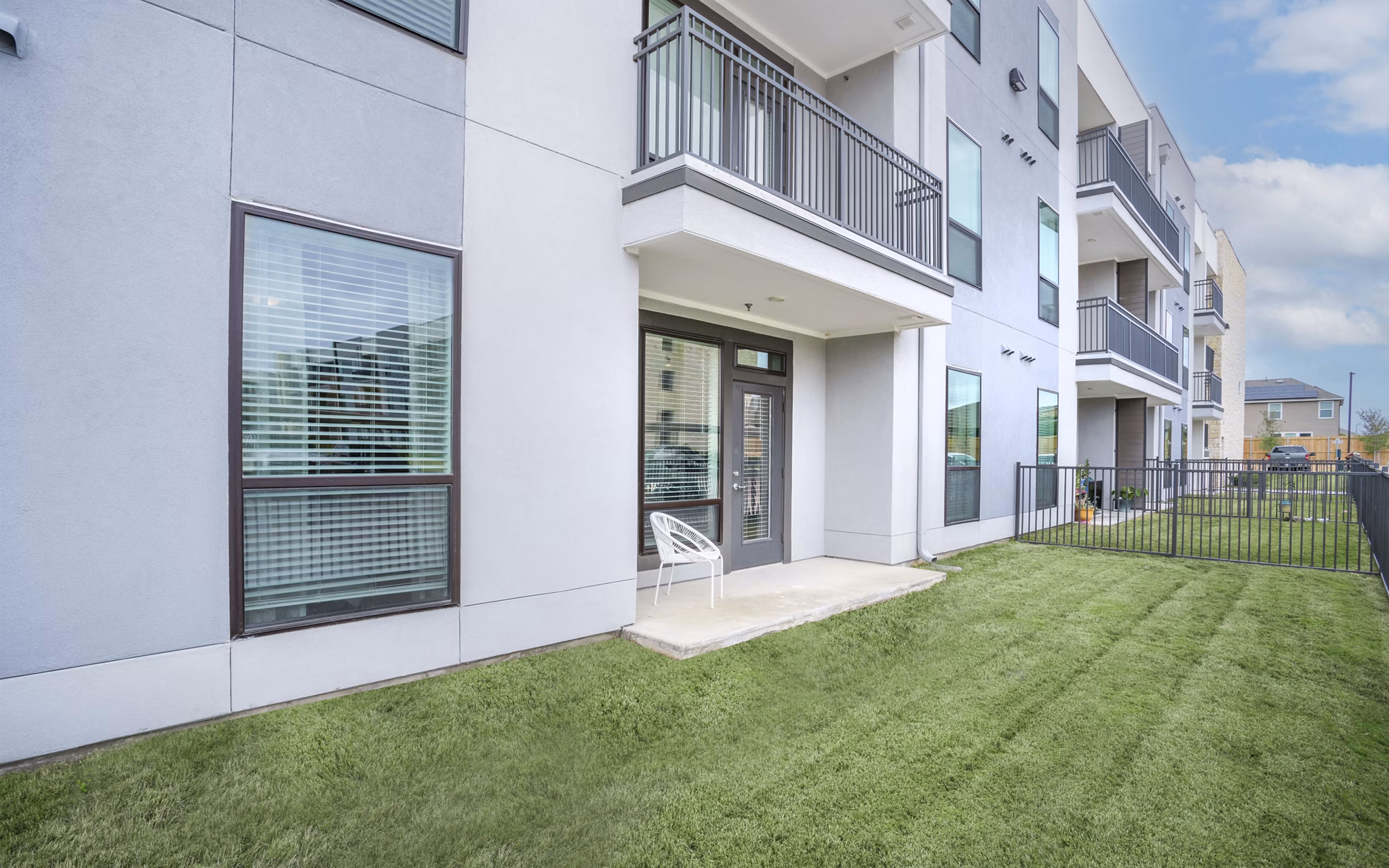 Spacious patio with comfortable seating at The Sommery Apartments, perfect for relaxing or entertaining outdoors