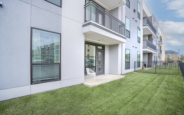 Spacious patio with comfortable seating at The Sommery Apartments, perfect for relaxing or entertaining outdoors