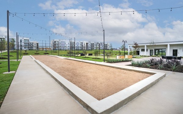 Courtyard with lush gardens and seating areas at The Sommery Apartments luxury community