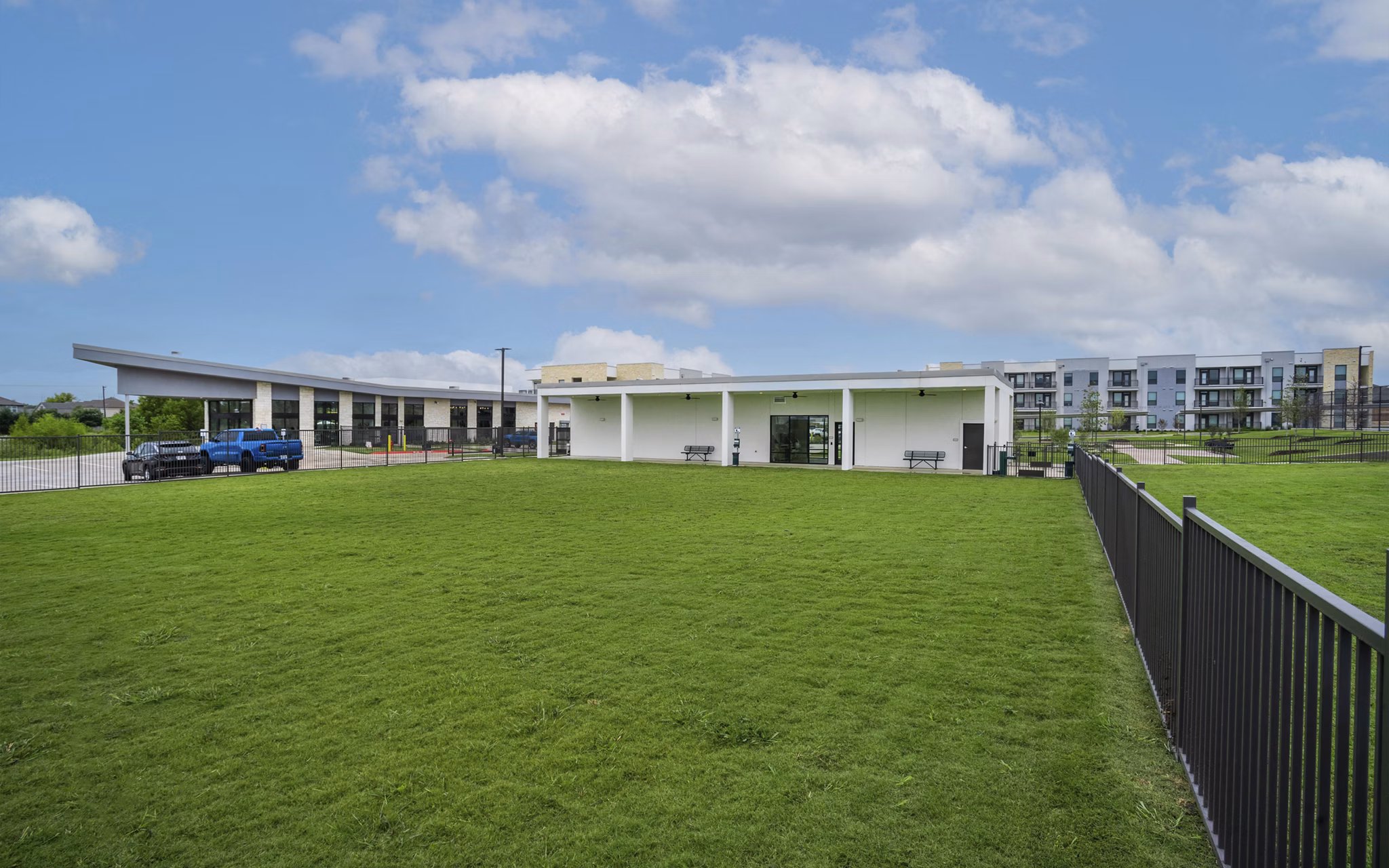 Spacious dog park with agility equipment at The Sommery Apartments