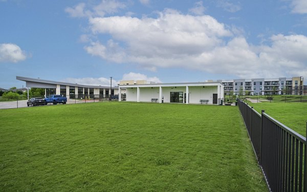 Spacious dog park with agility equipment at The Sommery Apartments