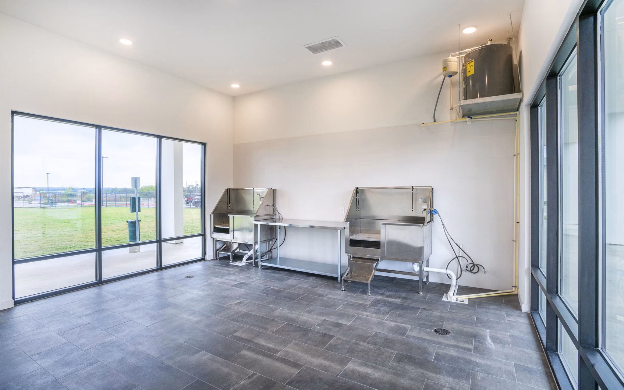 Dog wash station with modern facilities at The Sommery Apartments, offering convenient pet care for residents in a luxury setting