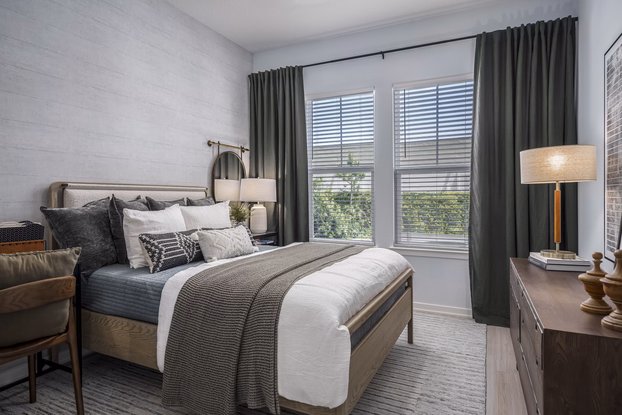 Spacious bedroom with modern decor at The Elliott Apartments, featuring luxury accommodations in a prime location