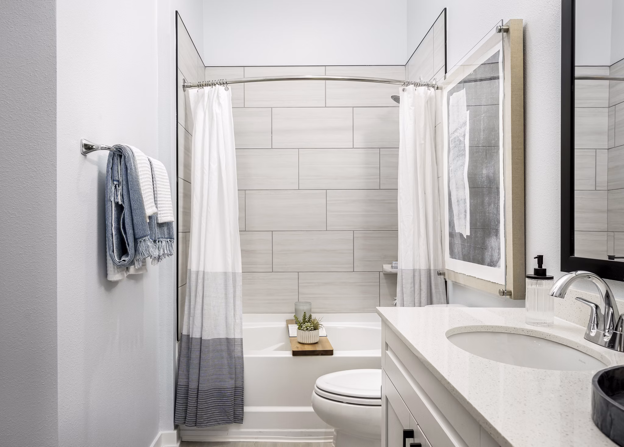 Bathroom at The Elliott Apartments: Bright bathroom with modern fixtures and sleek finishes in luxury apartments