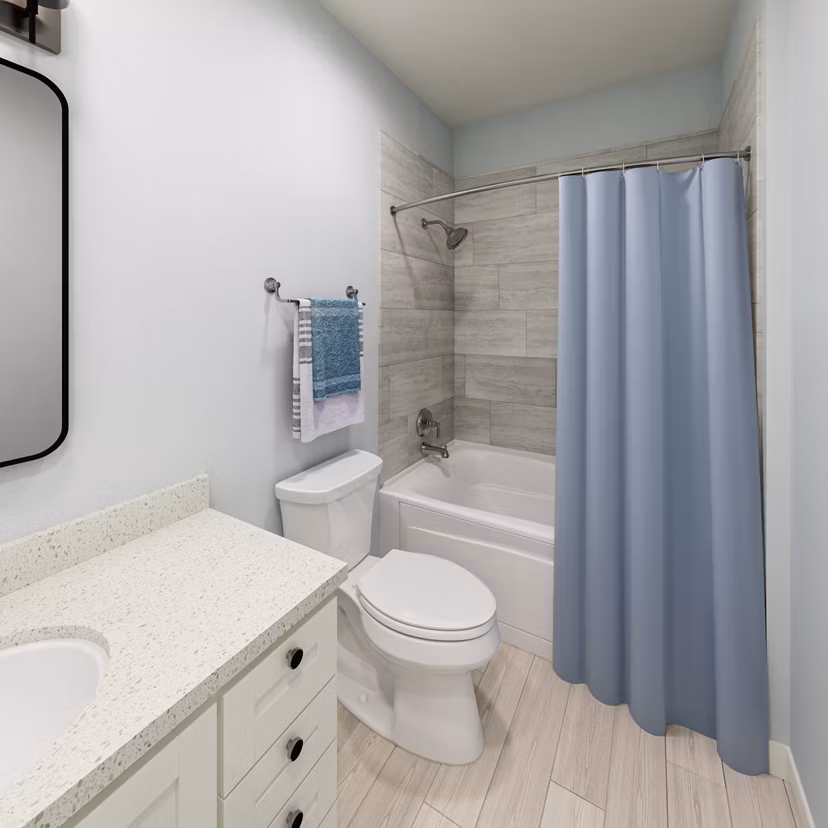 Elliott Apartments bathroom featuring modern fixtures and sleek design