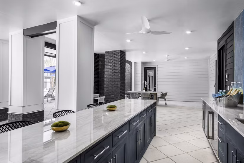 Clubhouse featuring modern design at The Elliott Apartments with seating and gathering spaces for residents