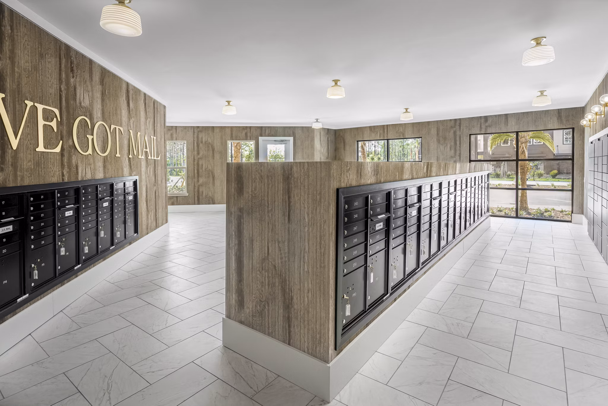 Mail room with secure parcel lockers at The Elliott Apartments