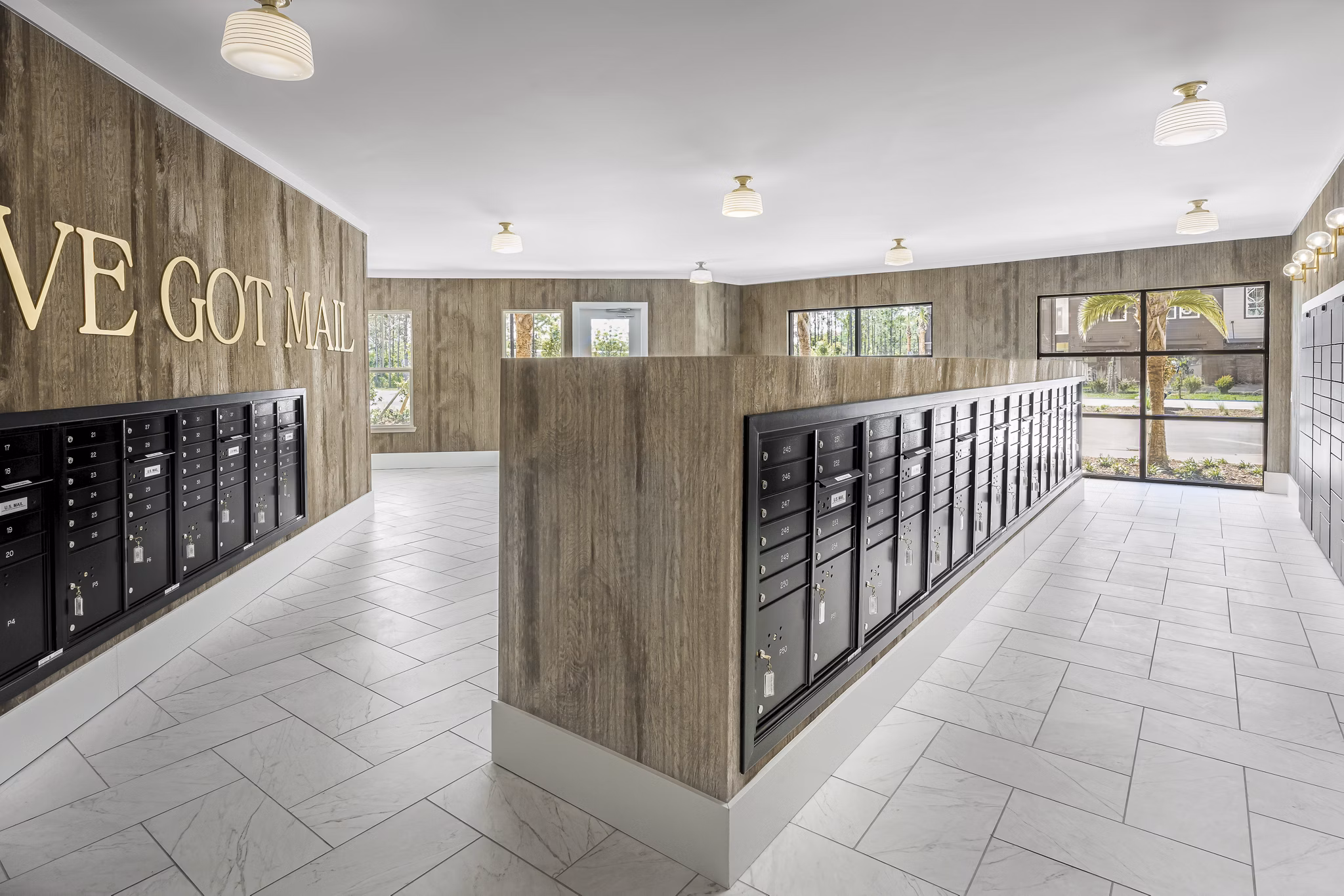Mail room with secure parcel lockers at The Elliott Apartments