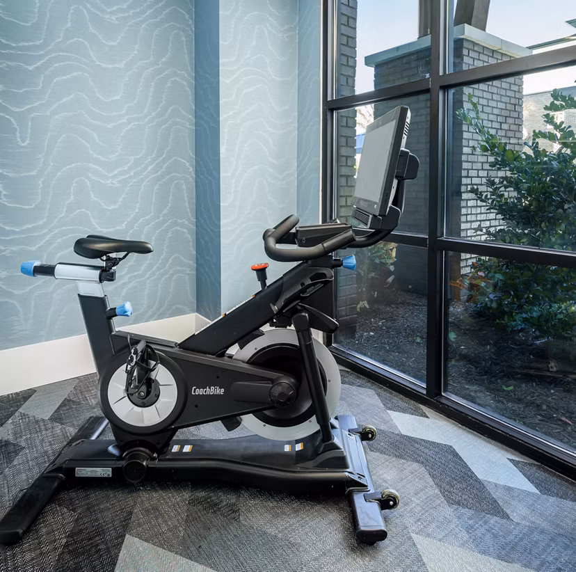Spin studio with state-of-the-art equipment at The Elliott Apartments, ideal for fitness enthusiasts seeking luxury living spaces