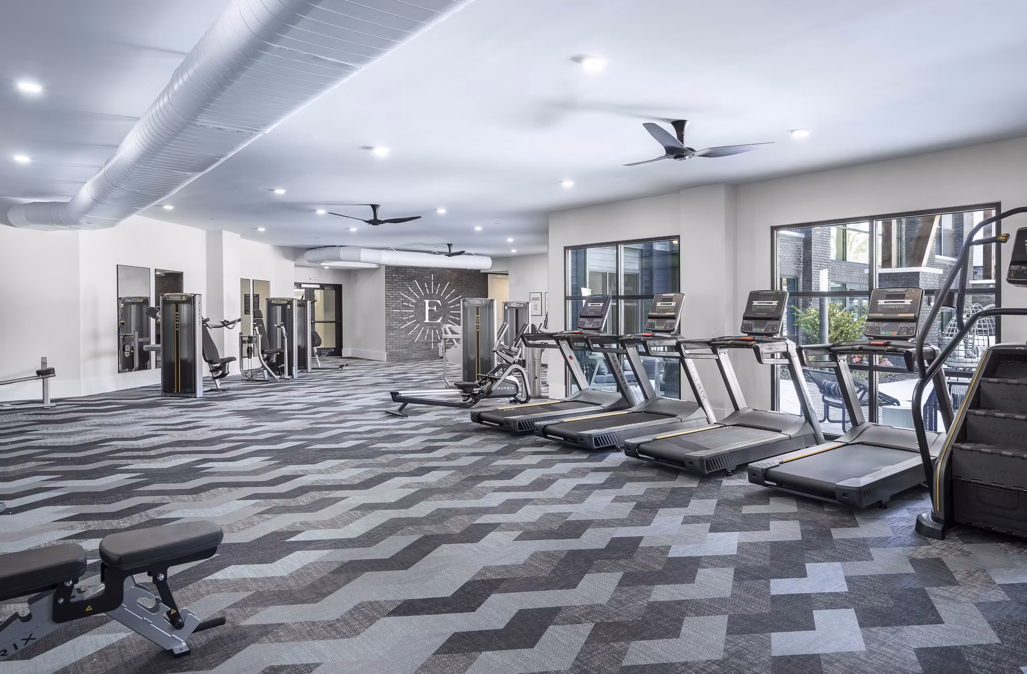 State-of-the-art fitness center with modern equipment at The Elliott Apartments
