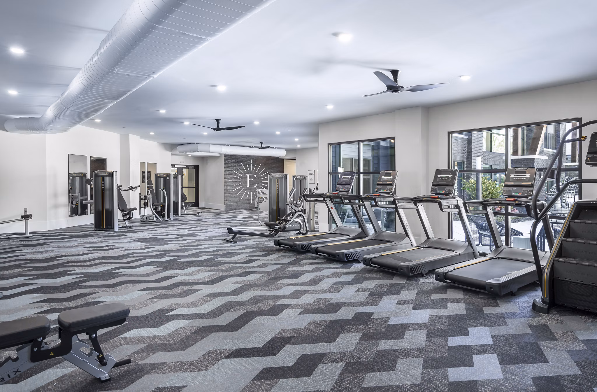 State-of-the-art fitness center with modern equipment at The Elliott Apartments