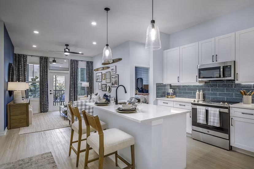 Modern kitchen with stainless steel appliances at The Elliott Apartments