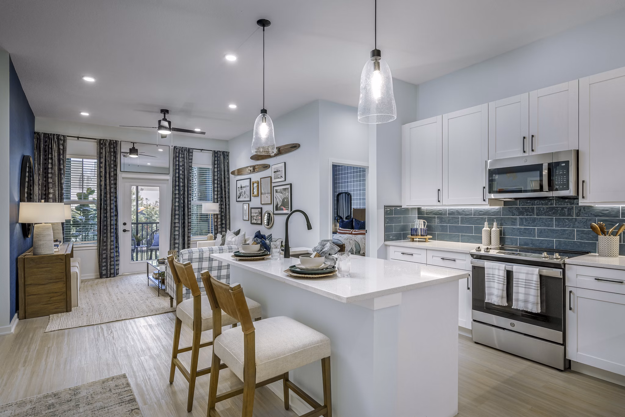 Modern kitchen with stainless steel appliances at The Elliott Apartments