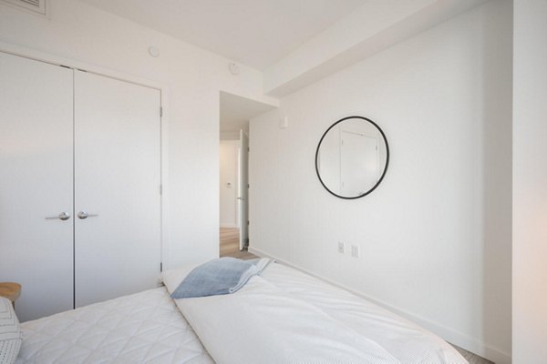 Elegant bedroom with contemporary decor in Collection 14 Apartments, offering luxury living spaces in a prime location