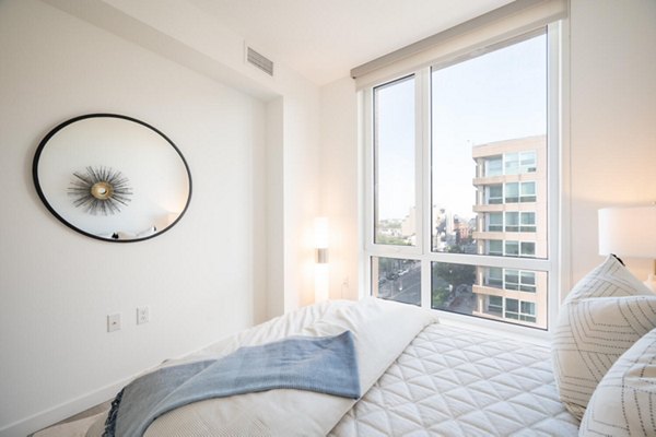 Cozy bedroom with modern decor at Collection 14 Apartments