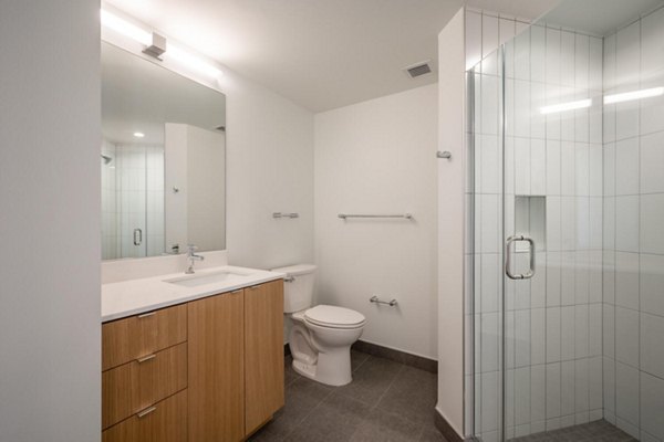 Bathroom featuring modern fixtures in Collection 14 Apartments