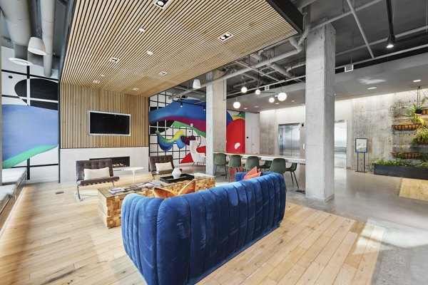 Modern clubhouse with stylish seating and fireplace at Collection 14 Apartments