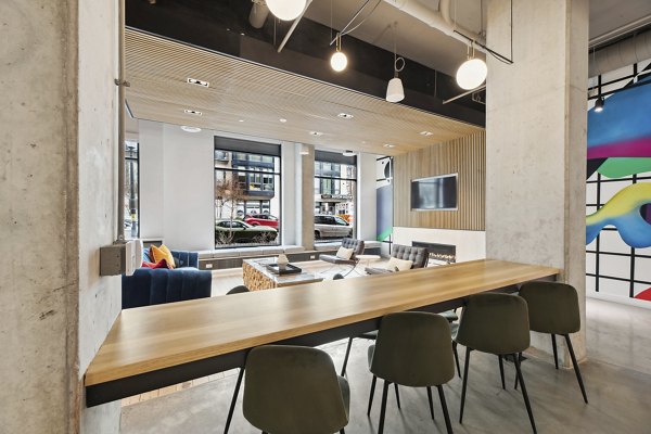 Clubhouse with modern seating areas and open spaces at Collection 14 Apartments