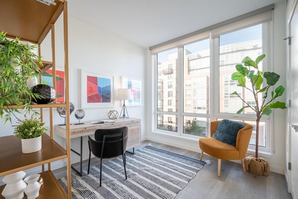 Home office space with ergonomic chair and desk in Collection 14 Apartments