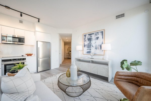Spacious living room with modern furnishings in Collection 14 Apartments
