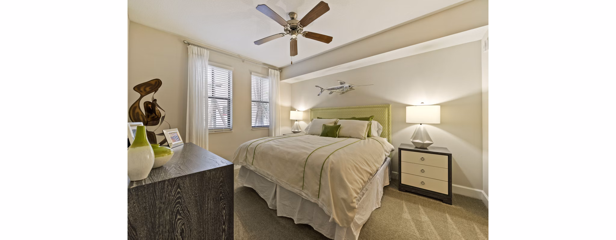 Ventura Pointe Apartments: Modern bedroom with stylish furniture and large windows