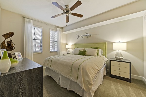 Ventura Pointe Apartments: Modern bedroom with stylish furniture and large windows