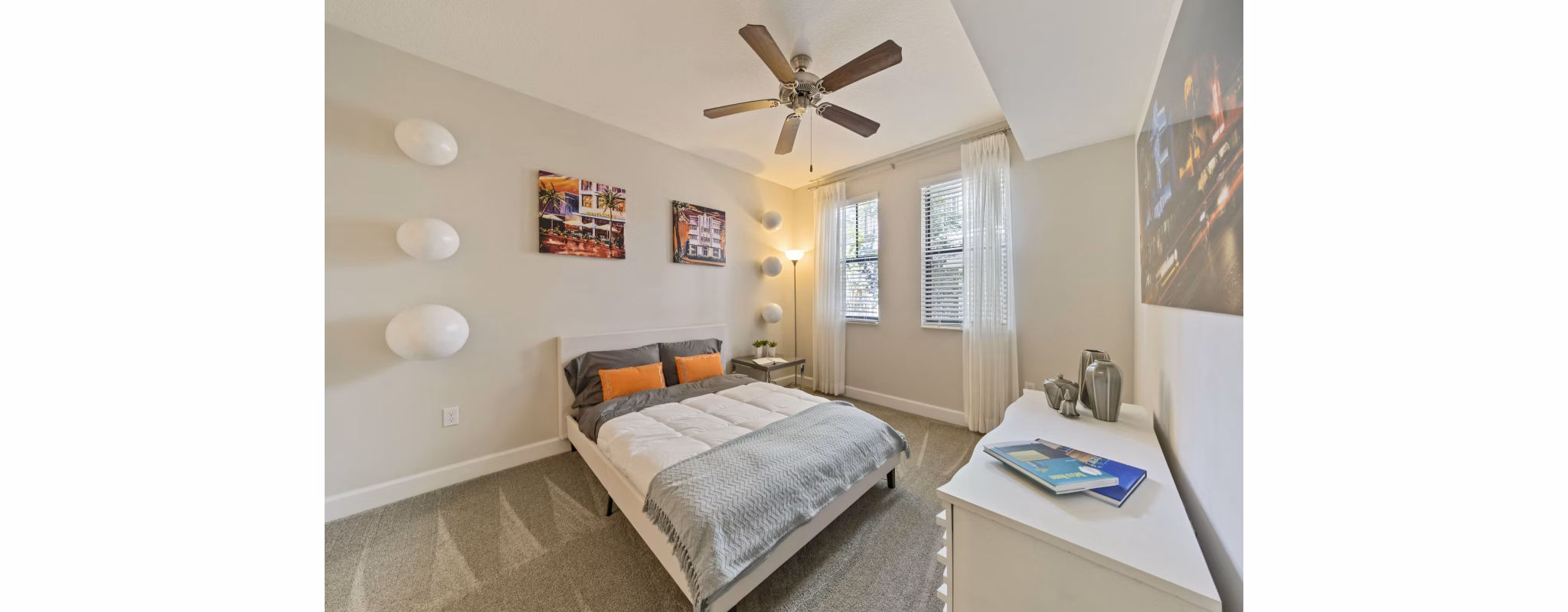 Cozy bedroom with modern furnishings in Ventura Pointe Apartments