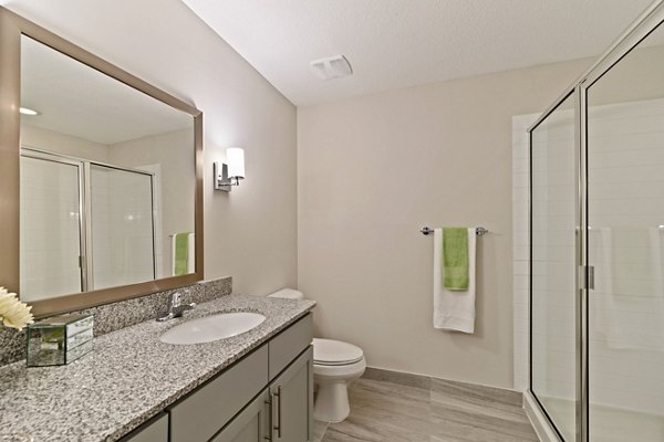 Bathroom with modern fixtures and sleek design at Ventura Pointe Apartments, showcasing luxury living at its finest