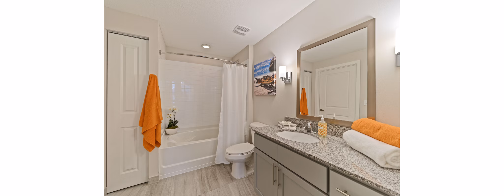 Bathroom featuring modern fixtures and marble countertops at Ventura Pointe Apartments