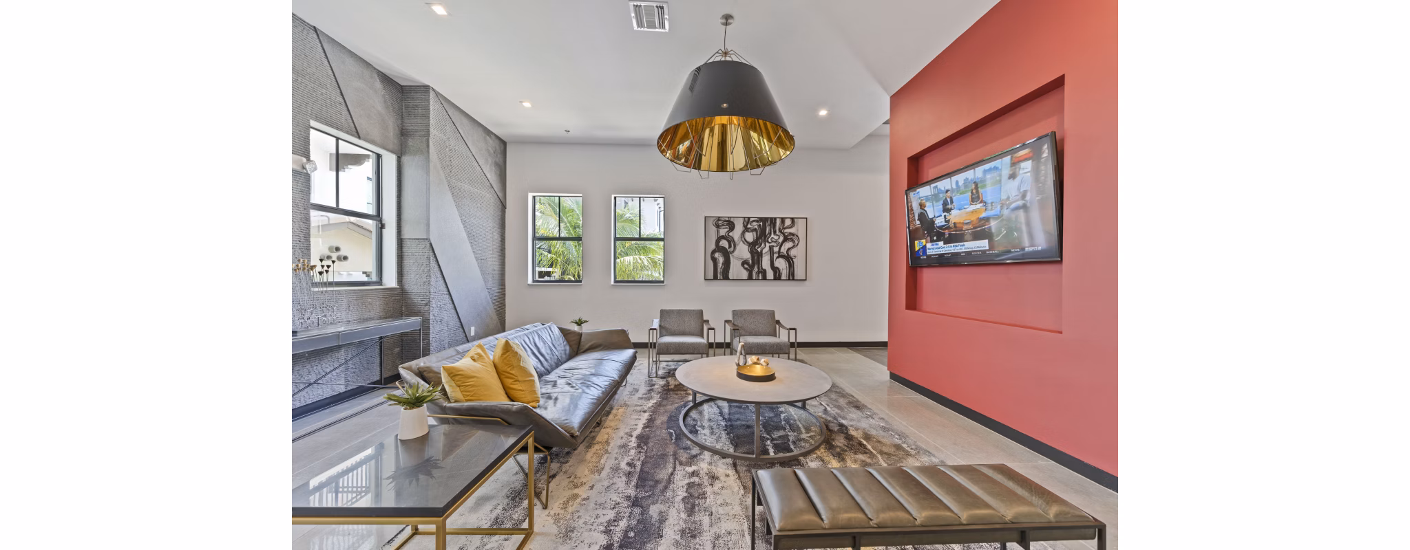Clubhouse featuring modern decor and ample seating at Ventura Pointe Apartments