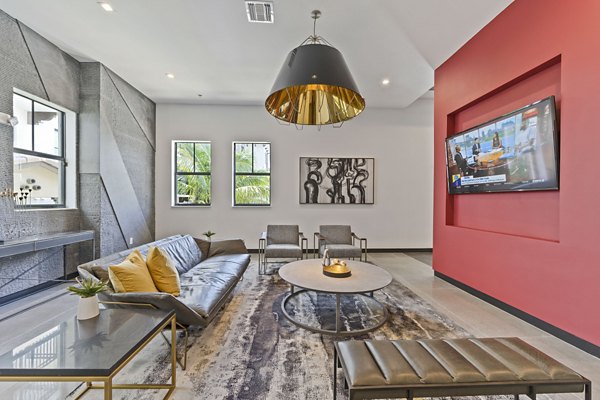 Clubhouse featuring modern decor and ample seating at Ventura Pointe Apartments