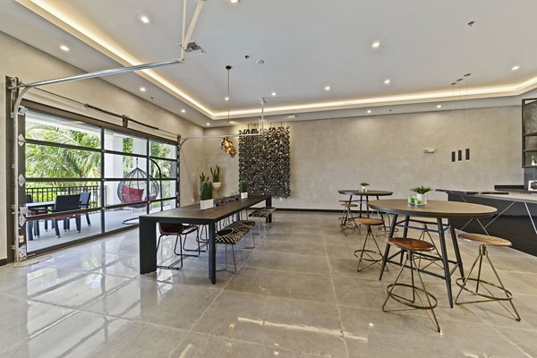 Ventura Pointe Apartments: Modern clubhouse with vibrant social areas in Pembroke Pines, FL